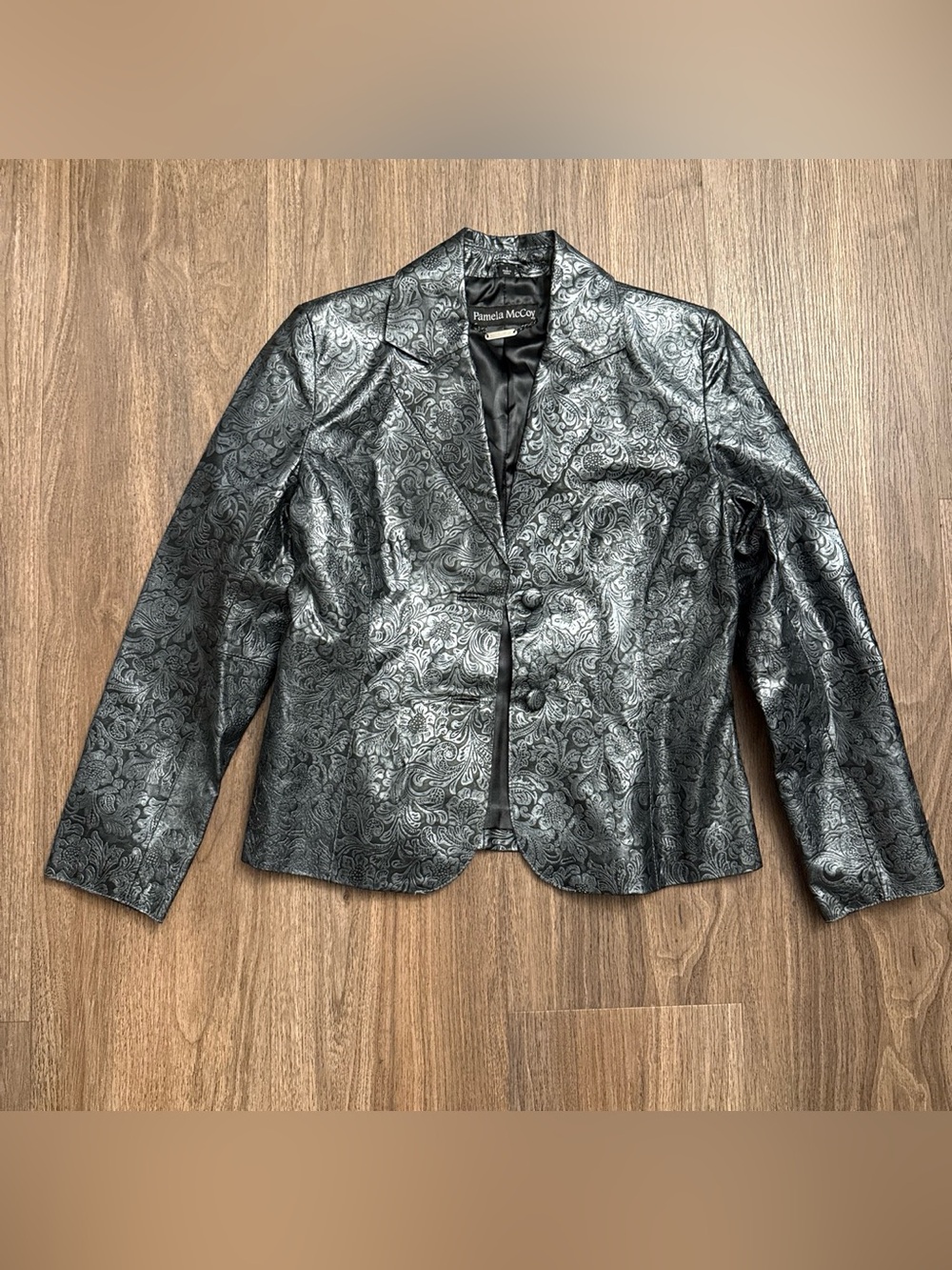 Vintage Pamela McCoy embossed Black & silver floral leather jacket. Size small.